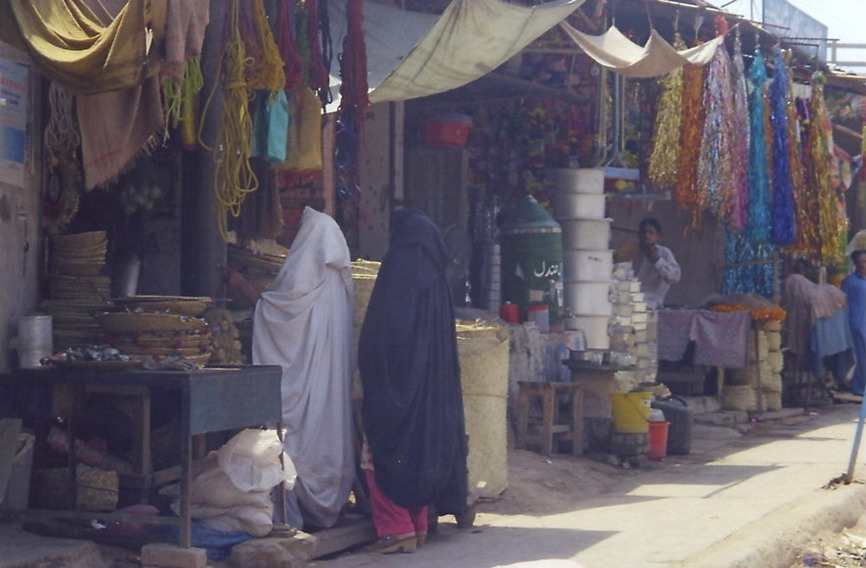 This market, beside the railroad tracks in Peshawar, is selling metallic streamers that look like Christmas tree tinsle but are in-fact for decorating the graves of recently deceased.