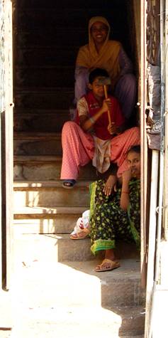 taking refuge from the heat, three smiling women