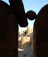 These stones are cut out of sandstone & line the ramparts to be pushed off at an enemy that might swarm up the fortifications. These wedged accidentally during the recent earthquake 59