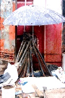 building's water supply protected from the searing heat by an umbrella 200