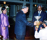 Accepting prize from Kofi Annan