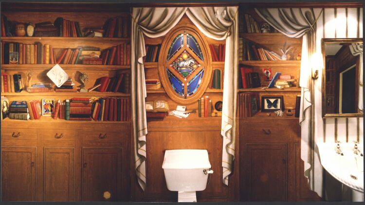 Mural: montage of three walls of a powder room painted to look like a library with cabinets. Oils over acrylics. The leaded glass window was designed by Paul Herman & the work commissioned to a leaded glass window maker.