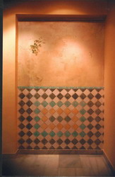 Trompe l'oeil wall with tiles & vine.