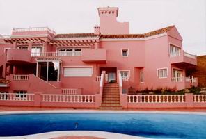 House with swimming pool in the foreground.