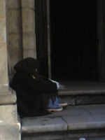 Beggar on the church steps